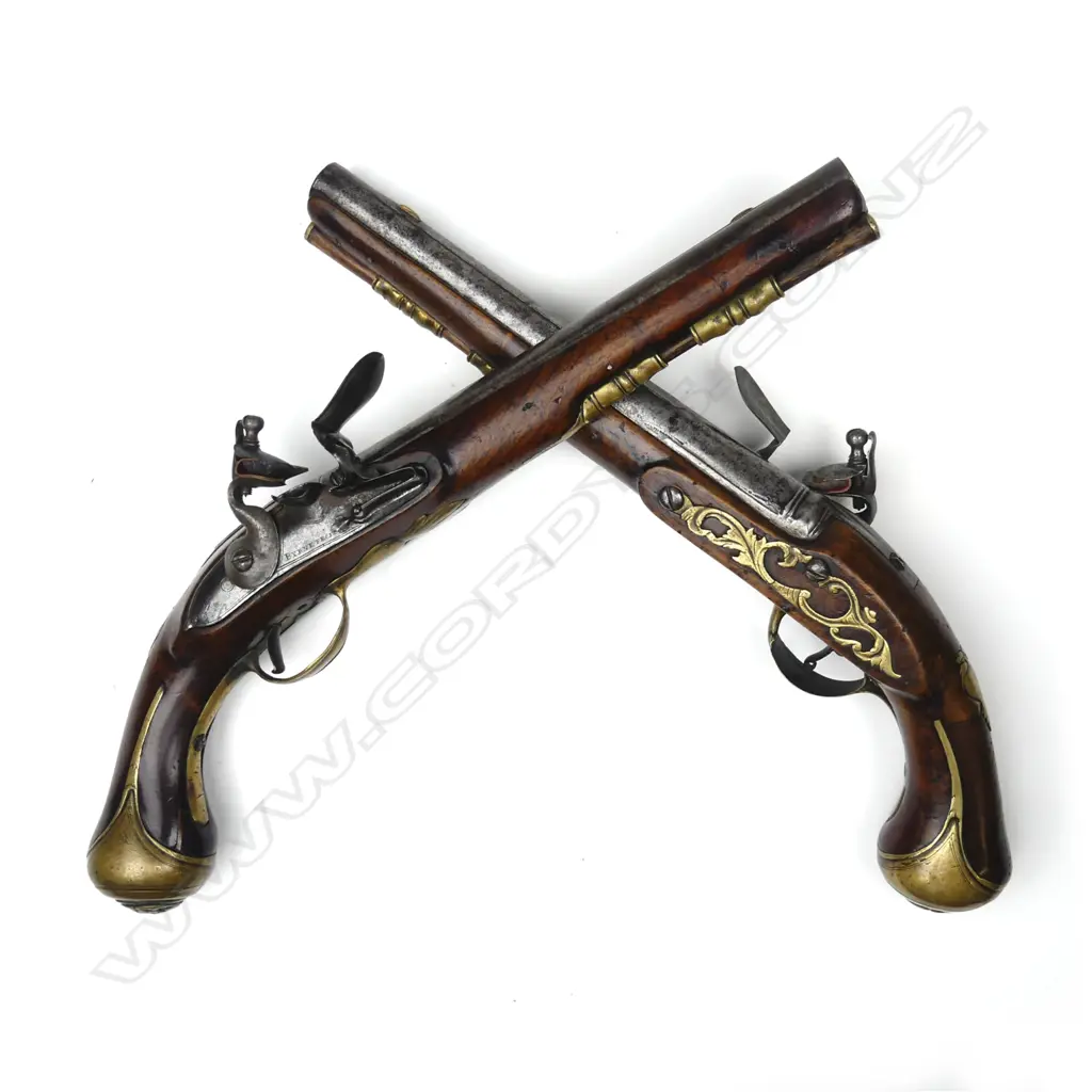 A pair of Irish flintlock coach pistols Image 1++
