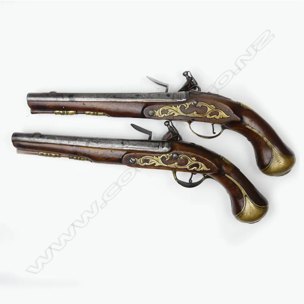 A pair of Irish flintlock coach pistols Image 1++