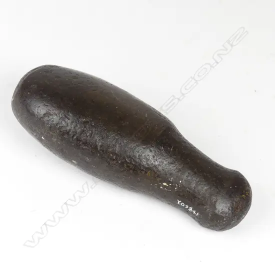 A pre-European Maori patu muka (stone flax pounder)