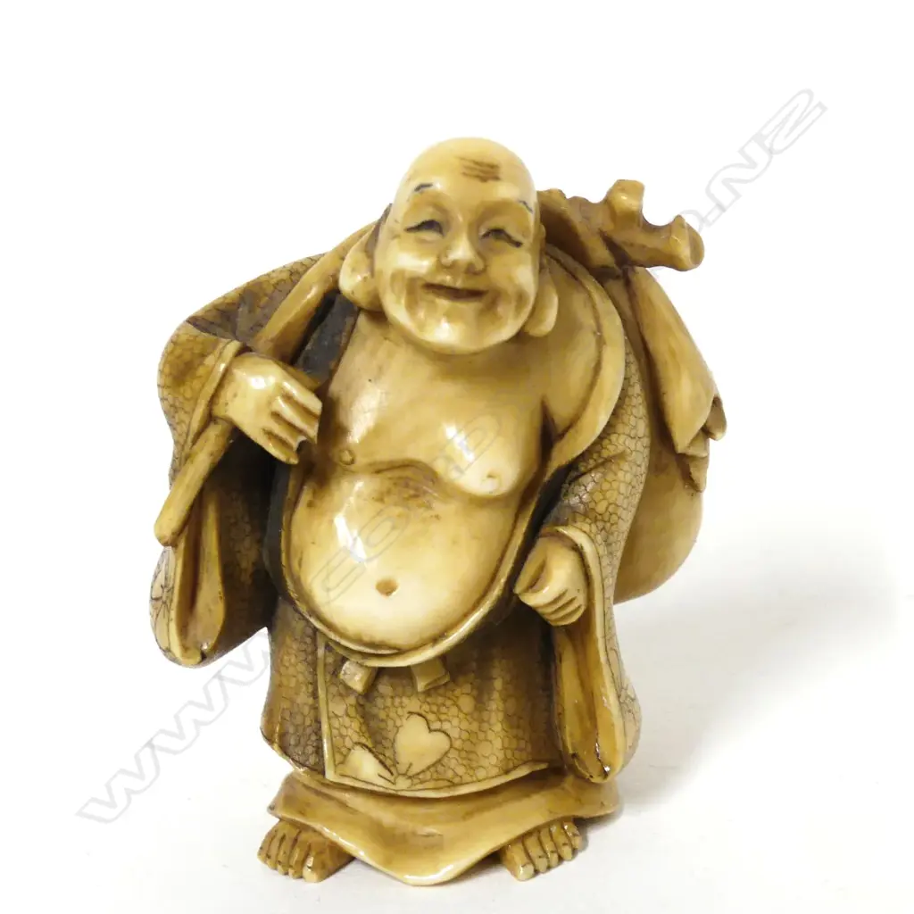 A Japanese ivory netsuke of Hotei Image 1++