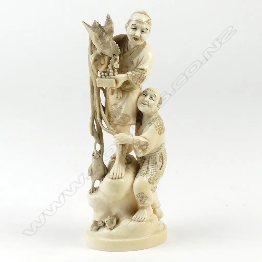 A Japanese ivory carved figure group Image 1++