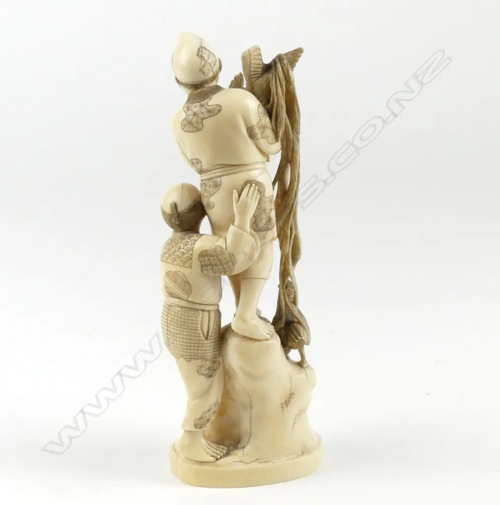 A Japanese ivory carved figure group Image 1++