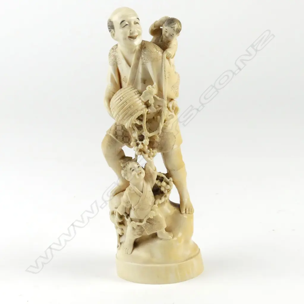 A Japanese ivory carved figure group Image 1++