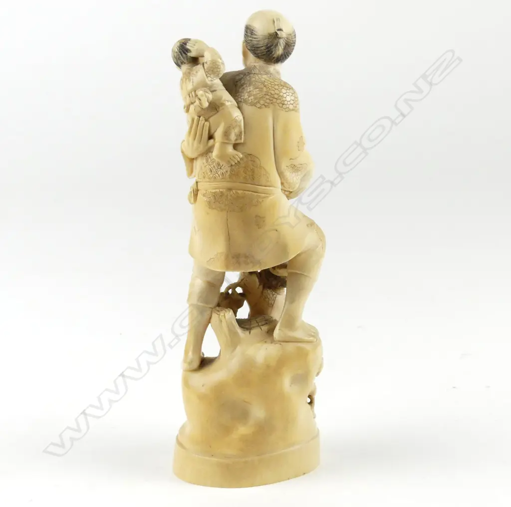 A Japanese ivory carved figure group Image 1++