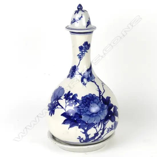 A Japanese Arita carafe with cover and saucer