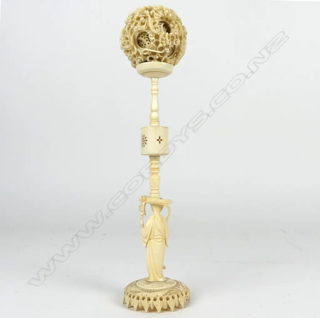 An old large Chinese carved ivory puzzle ball on stand Image 1++