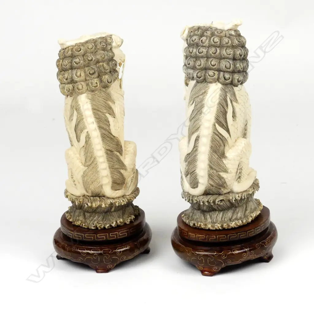 A pair of Chinese carved ivory xiezhi lion dogs Image 1++