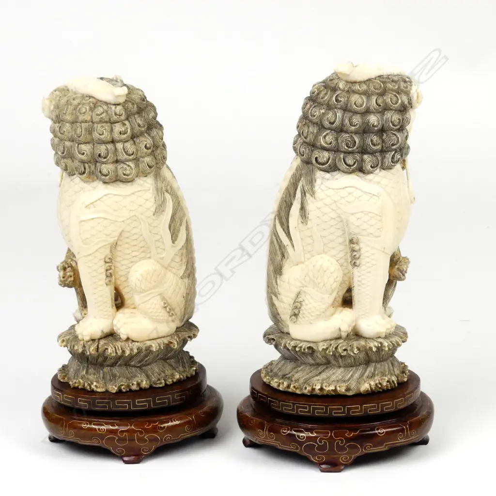 A pair of Chinese carved ivory xiezhi lion dogs Image 1++