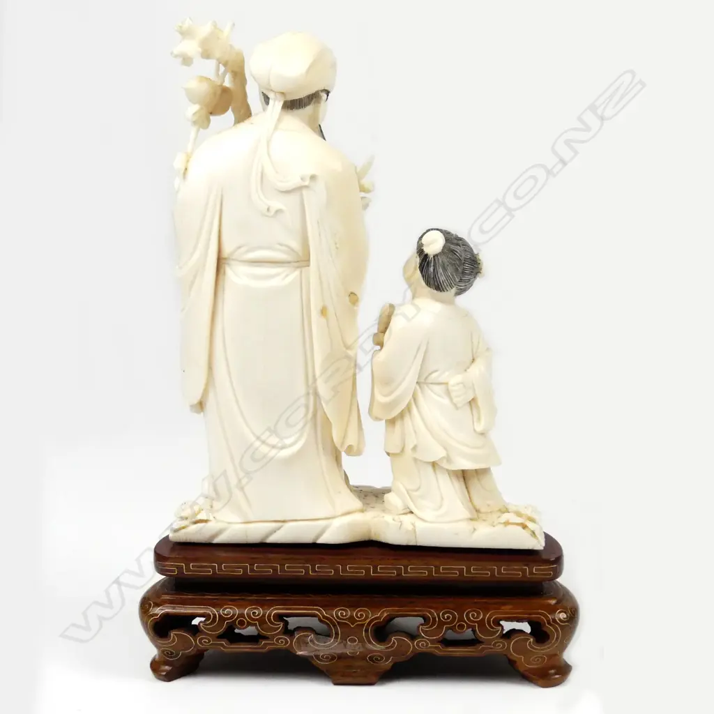 A Chinese carved ivory figure of Fu Image 1++