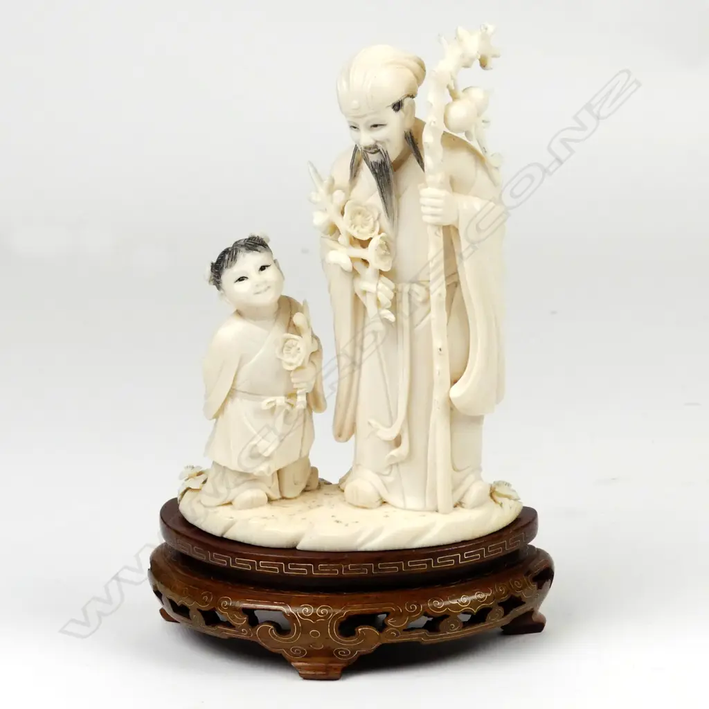 A Chinese carved ivory figure of Fu Image 1++