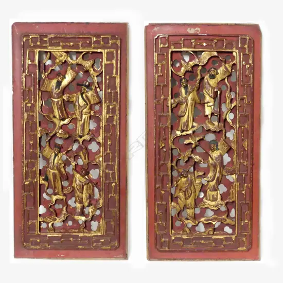A pair of old Chinese carved and red lacquered panels