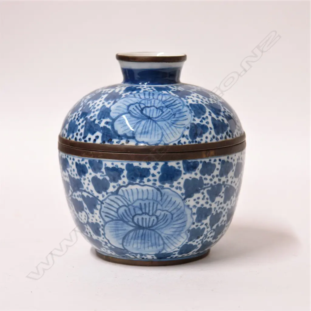An old Chinese blue and white lidded bowl with brass mounts Image 1++