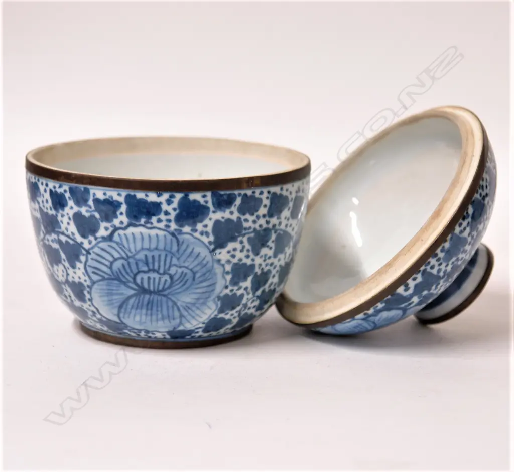 An old Chinese blue and white lidded bowl with brass mounts Image 1++