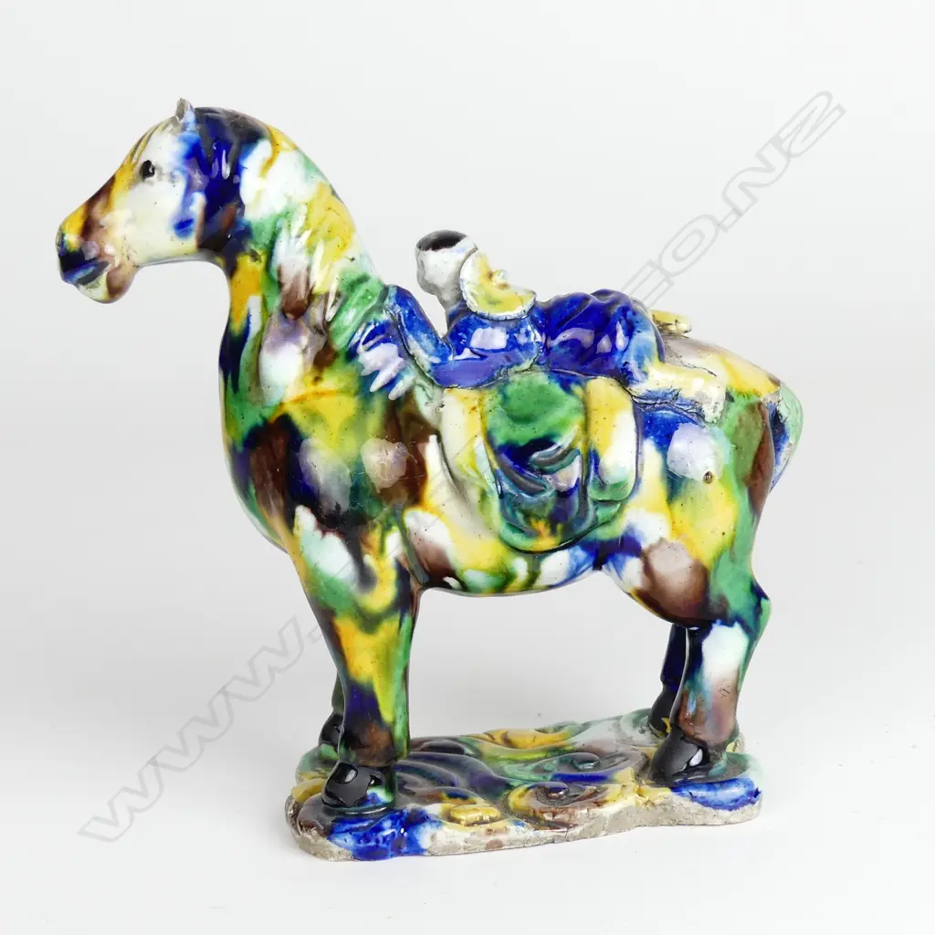 A Chinese porcelain small statuette of a horse and rider Image 1++