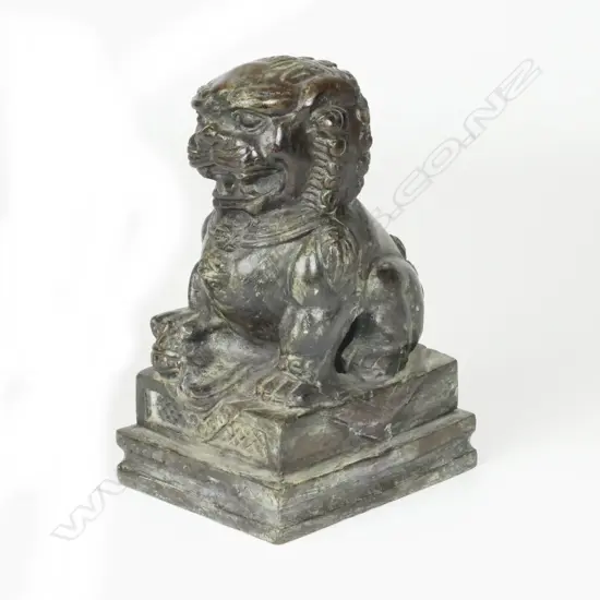 A Chinese bronze figure of a crouching kylin