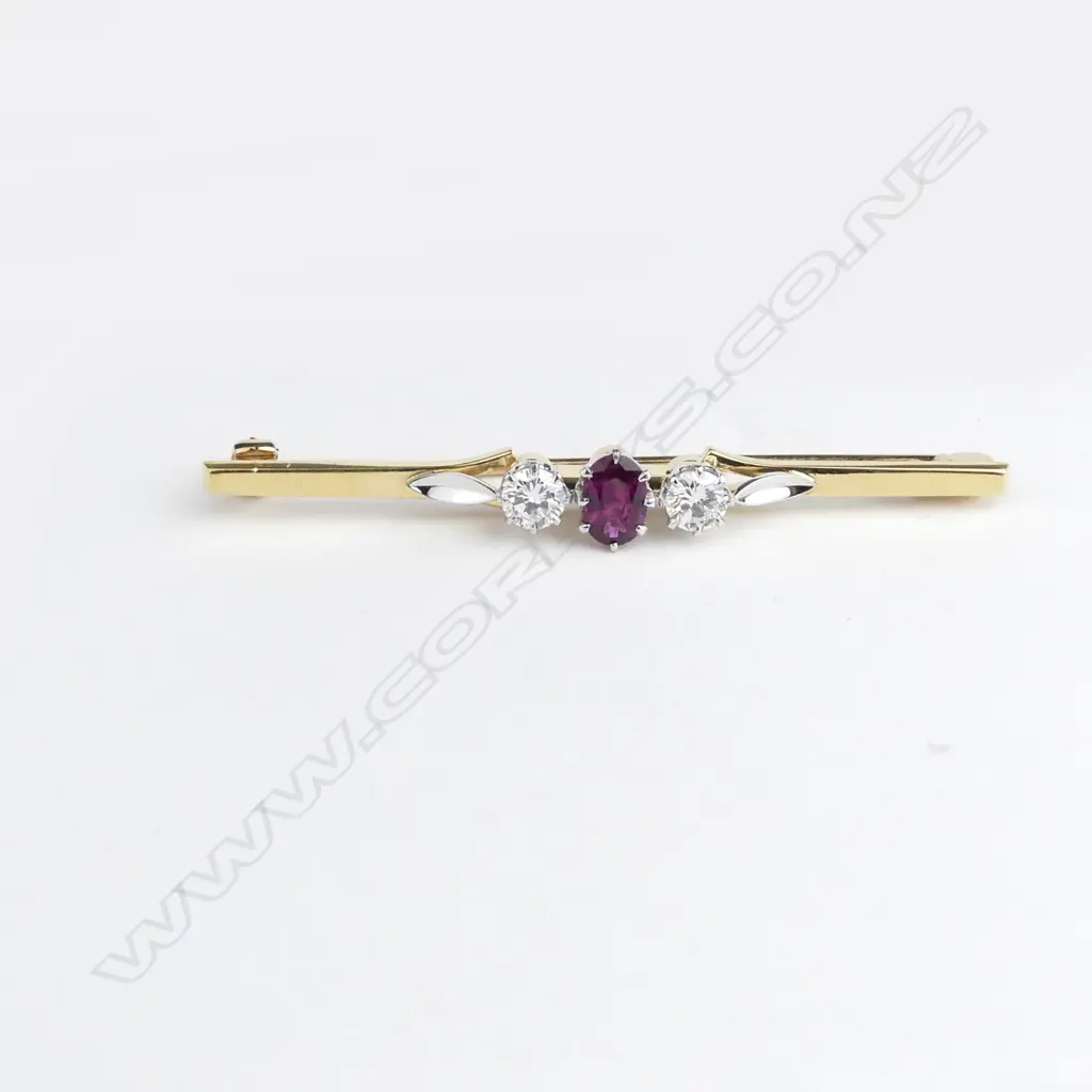 A lady's vintage 18ct. yellow and white gold ruby and diamond set bar brooch Image 1++