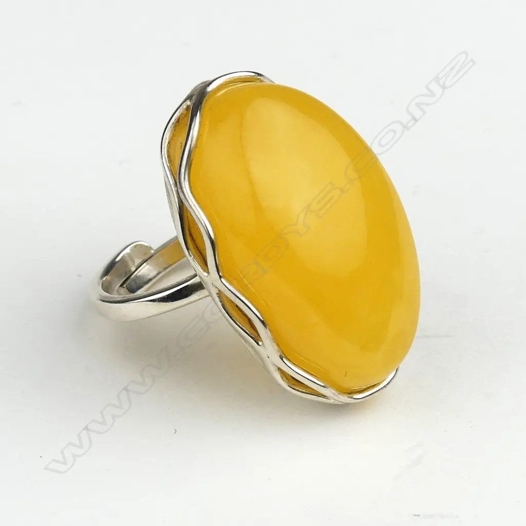 An amber and silver ring Image 1++