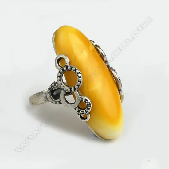 An amber and silver ring