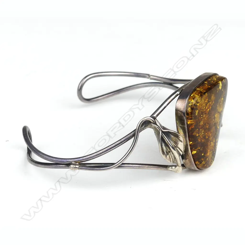 An Arts & Crafts amber and silver cuff bangle Image 1++