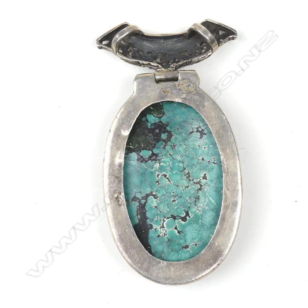 A large turquoise and silver pendant Image 1++