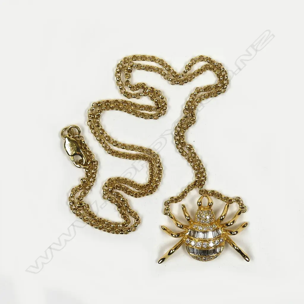 An 18ct. yellow gold and diamond spider pendant necklace Image 1++