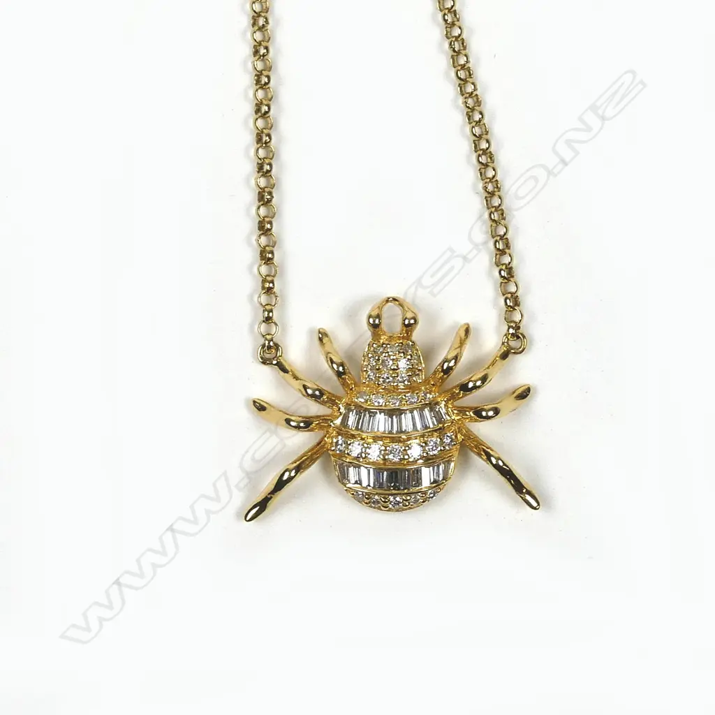 An 18ct. yellow gold and diamond spider pendant necklace Image 1++