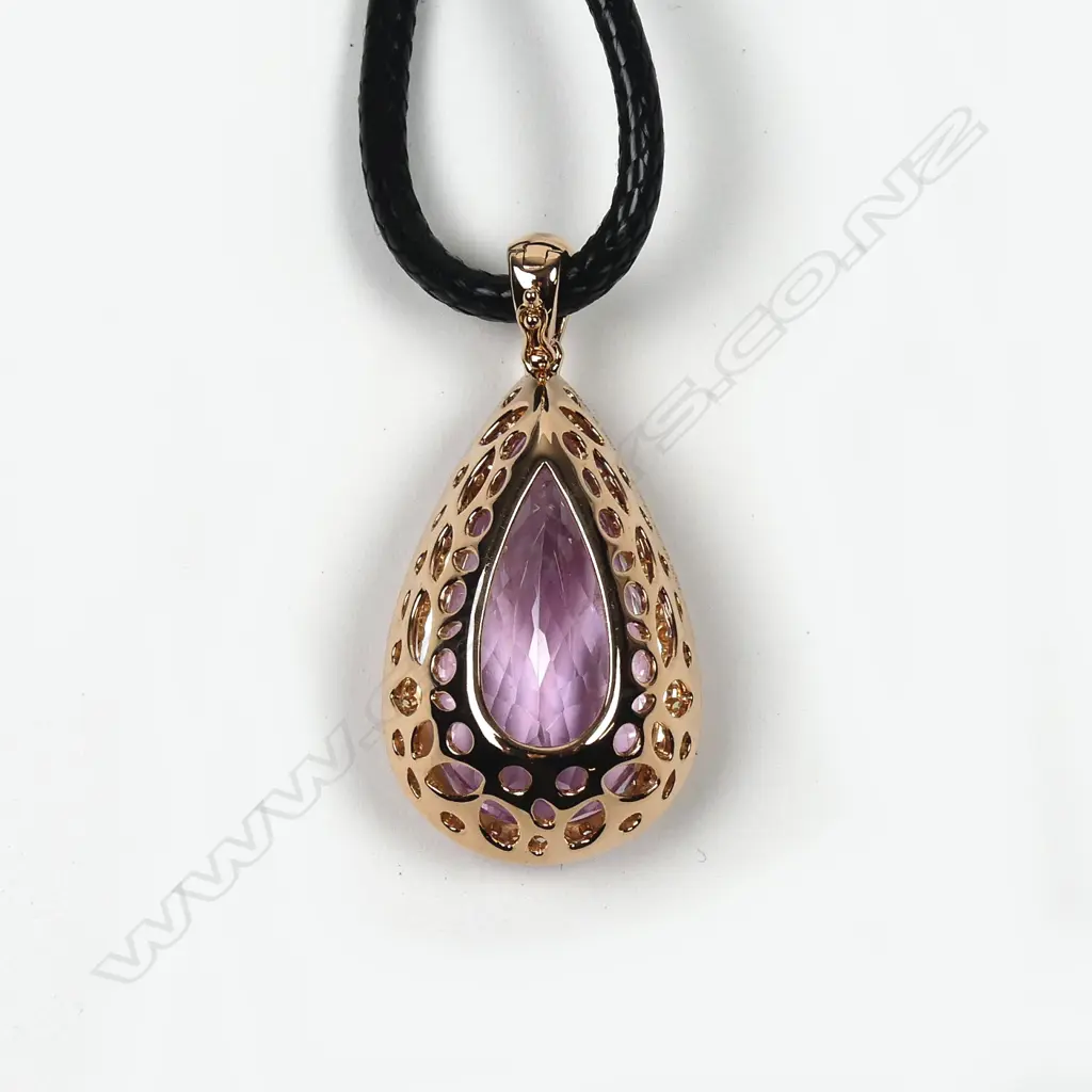 An impressive 18ct. rose gold large Kunzite and diamond pendant Image 1++