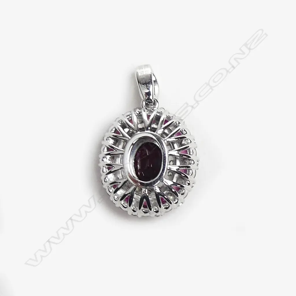 A 14ct white gold ruby and diamond pendant Image 1++