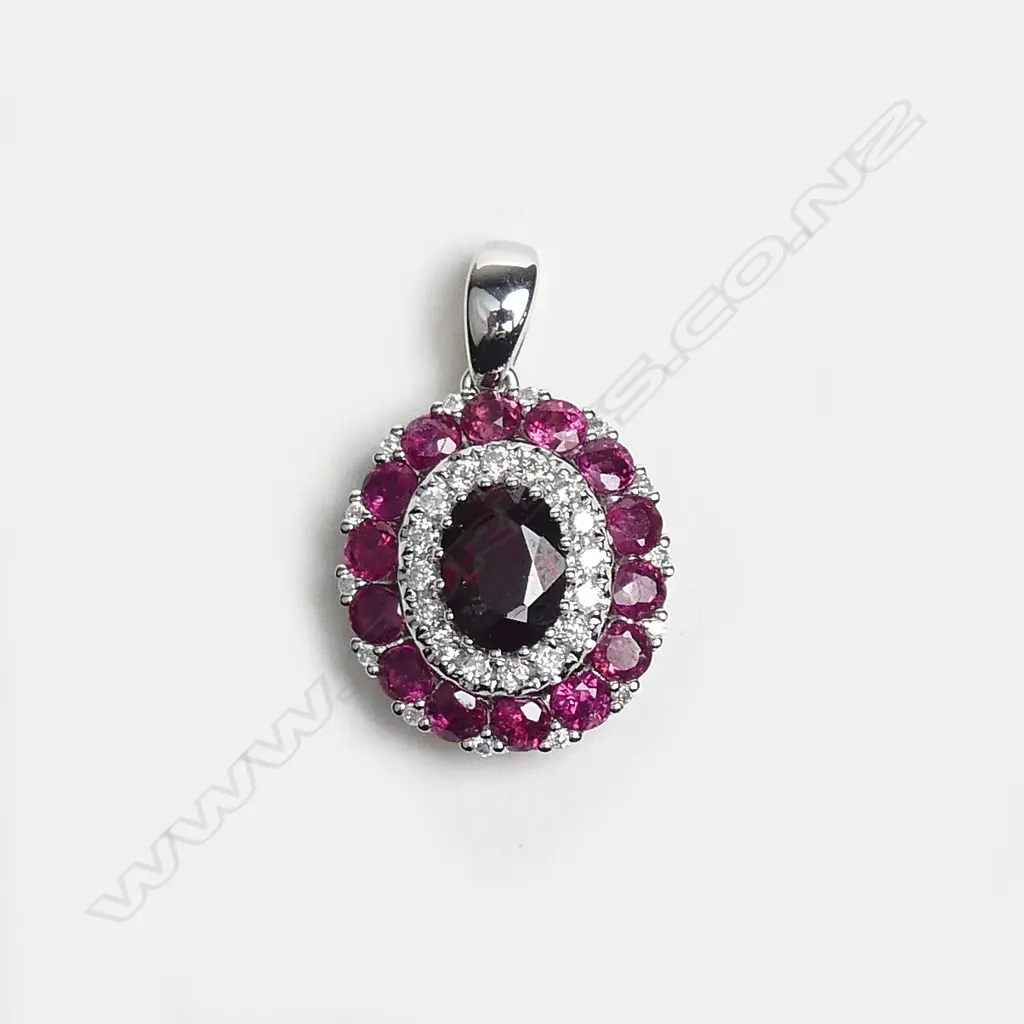 A 14ct white gold ruby and diamond pendant Image 1++