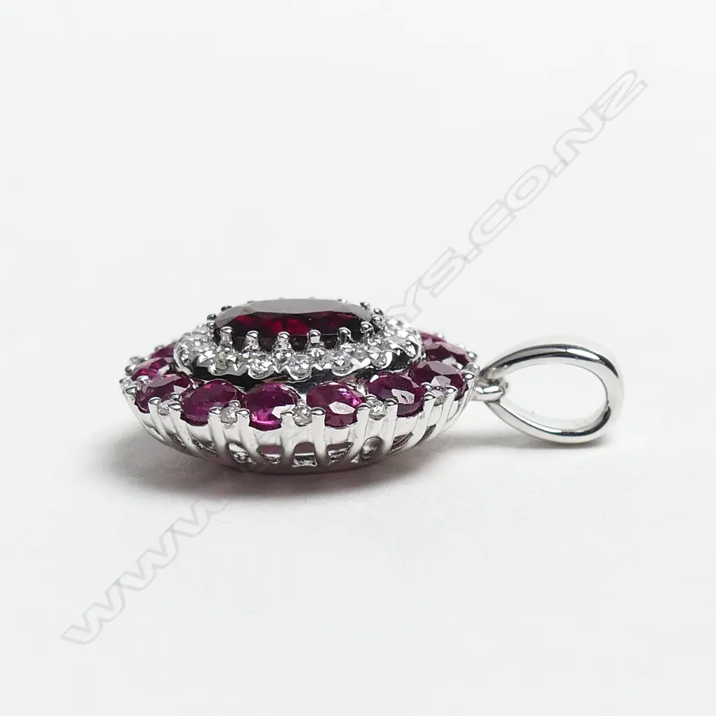A 14ct white gold ruby and diamond pendant Image 1++