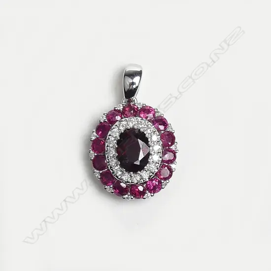 A 14ct white gold ruby and diamond pendant