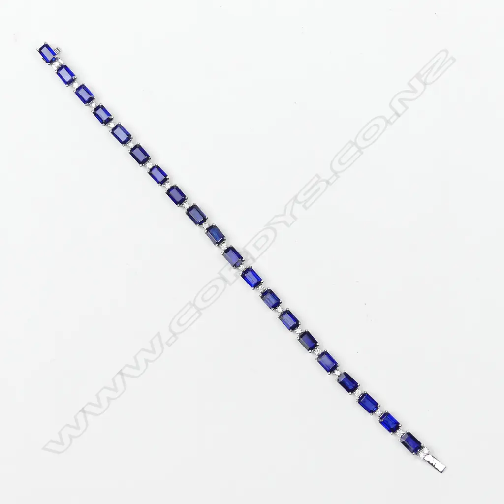 A 14ct white gold sapphire and diamond tennis bracelet Image 1++
