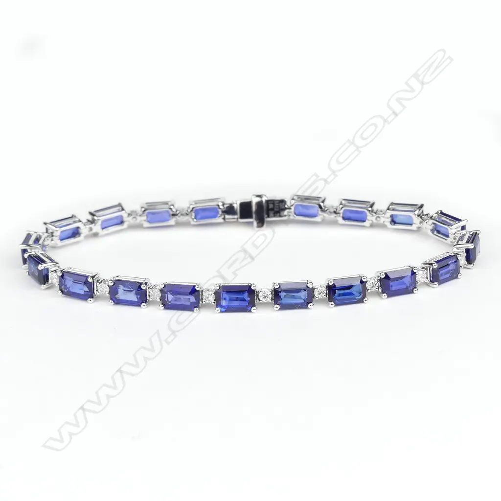 A 14ct white gold sapphire and diamond tennis bracelet Image 1++