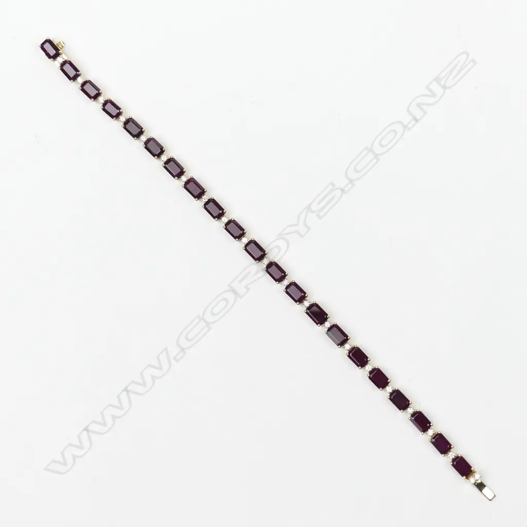 An 18ct gold ruby and diamond bracelet Image 1++