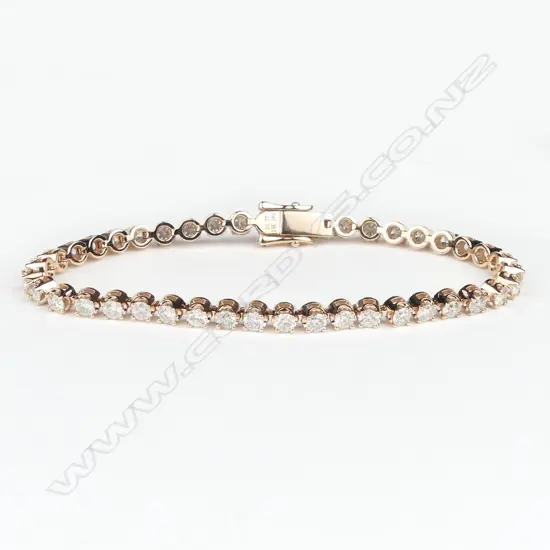 A 14ct rose gold and diamond tennis bracelet