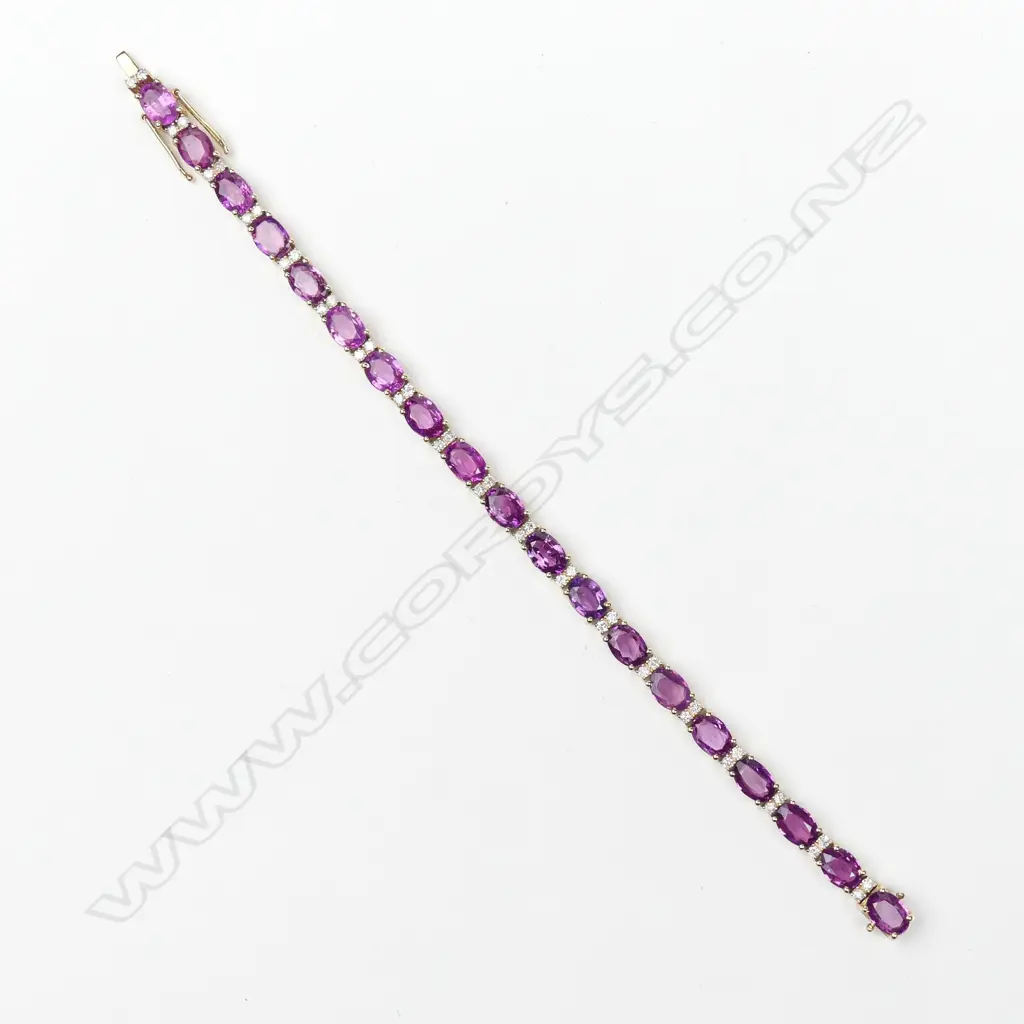 A 14ct gold pink sapphire and diamond bracelet Image 1++