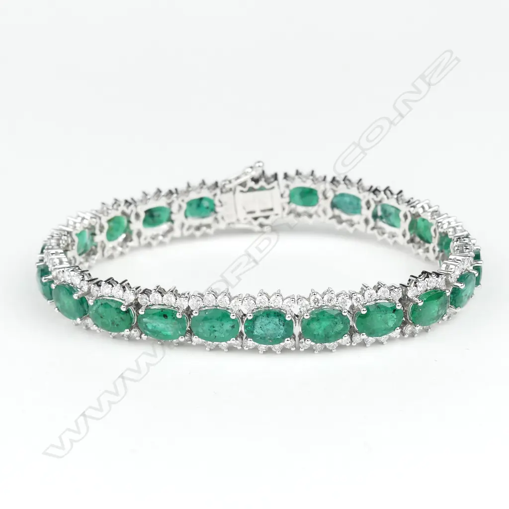 A 14ct white gold emerald and diamond bracelet Image 1++