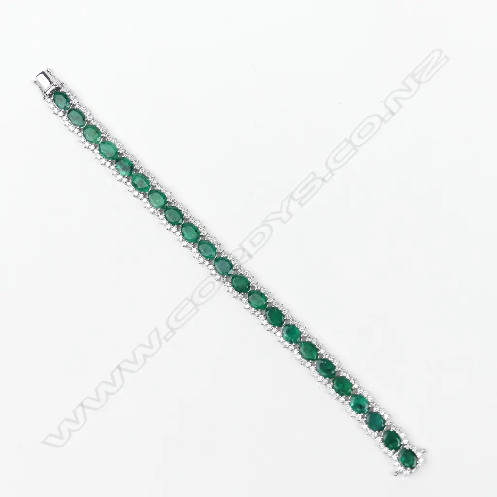 A 14ct white gold emerald and diamond bracelet Image 1++