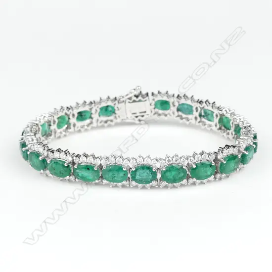 A 14ct white gold emerald and diamond bracelet