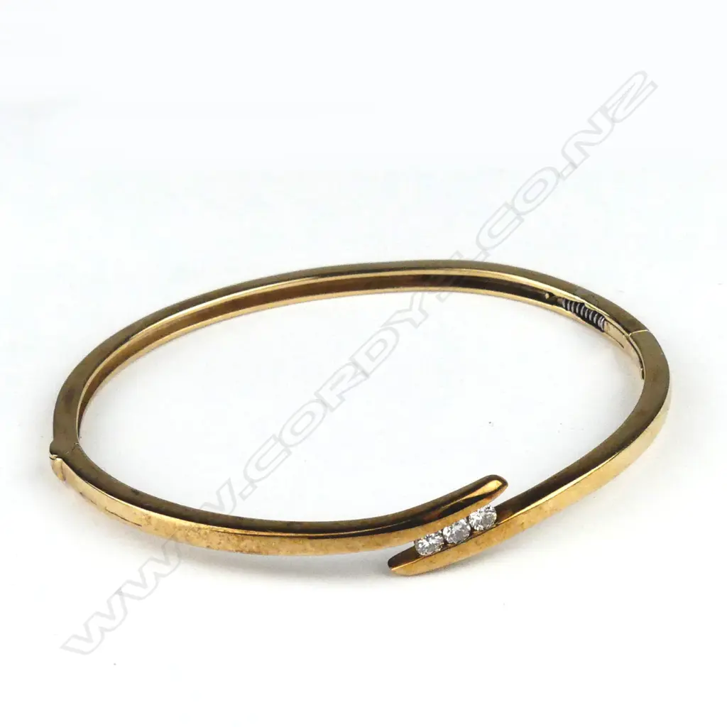 A vintage 9ct gold and diamond set hinged bangle Image 1++