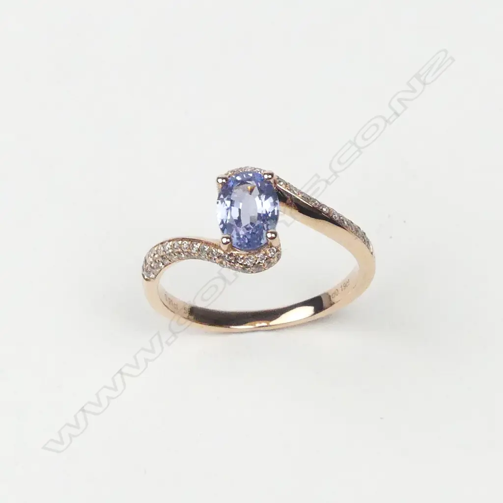 A 14ct rose gold sapphire and diamond ring Image 1++