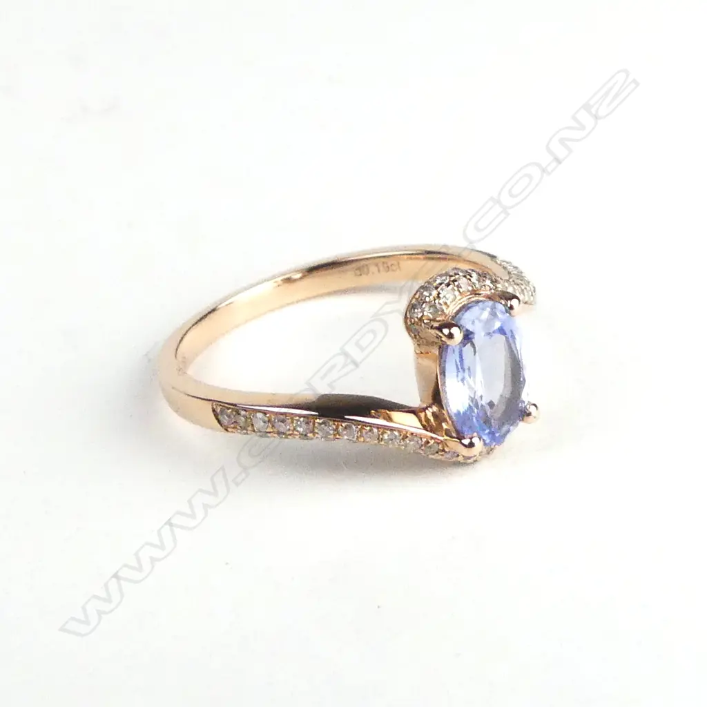 A 14ct rose gold sapphire and diamond ring Image 1++