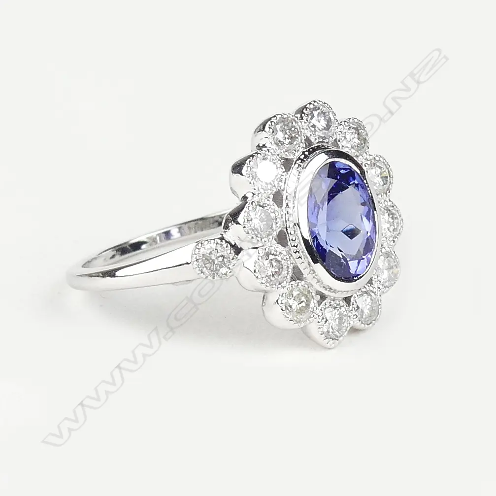 An 18ct white gold tanzanite and diamond ring Image 1++