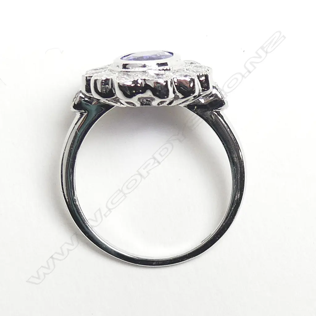 An 18ct white gold tanzanite and diamond ring Image 1++