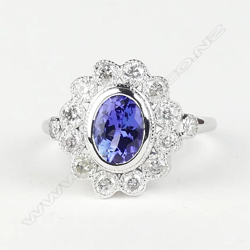 An 18ct white gold tanzanite and diamond ring Image 1++