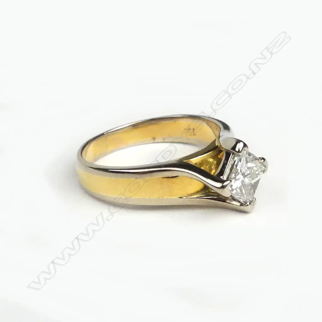 An 18ct gold and diamond solitaire ring Image 1++