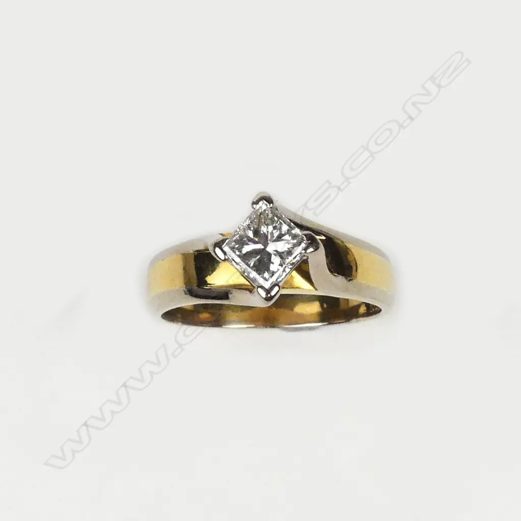 An 18ct gold and diamond solitaire ring Image 1++