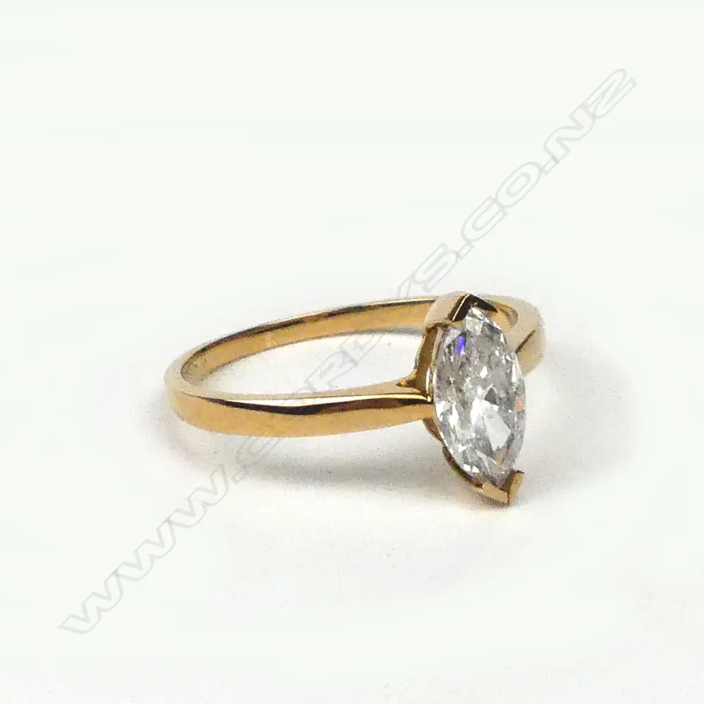 A 14ct gold and diamond solitaire ring Image 1++