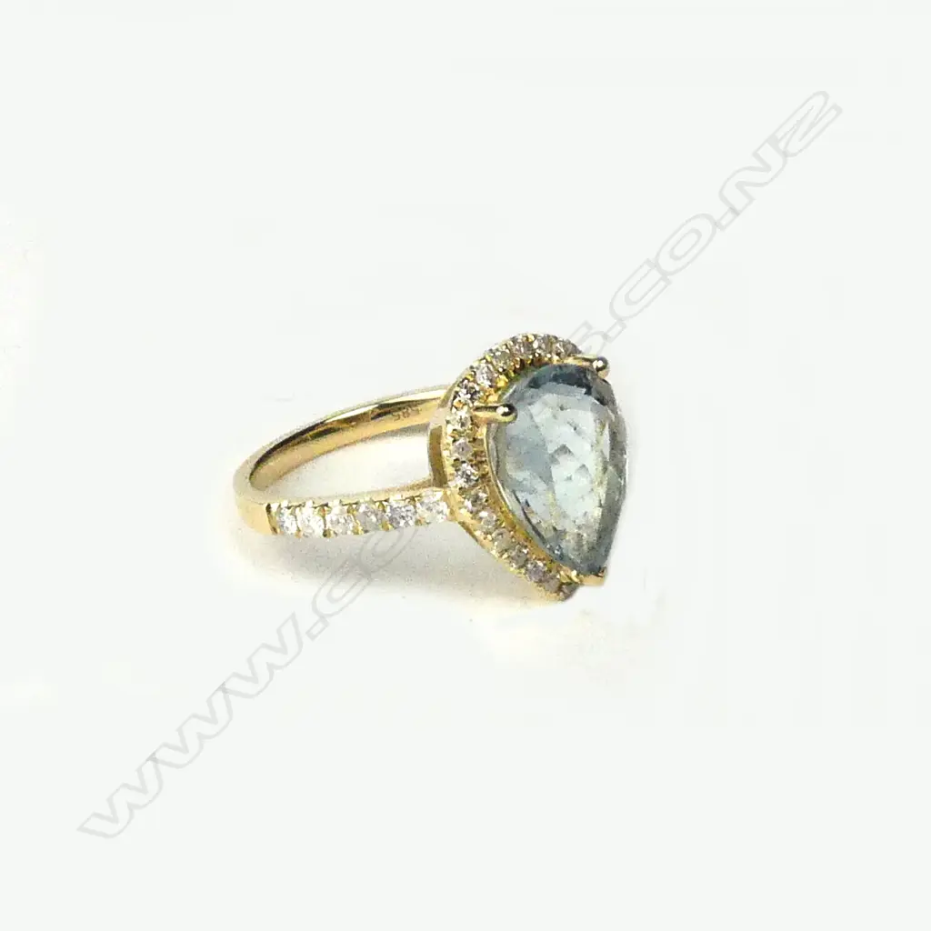 A 14ct gold aquamarine and diamond ring Image 1++