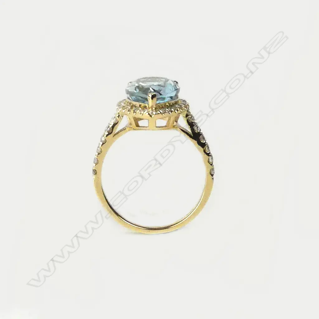 A 14ct gold aquamarine and diamond ring Image 1++
